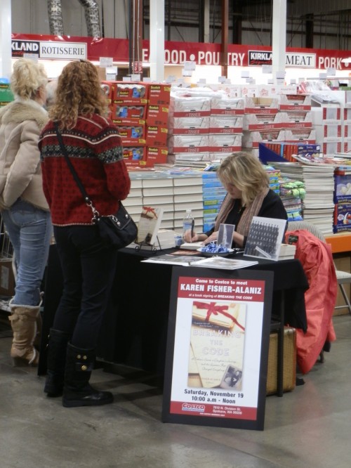 How to Write a Book in 10 Days: Me signing copies of my first published book, Breaking the Code