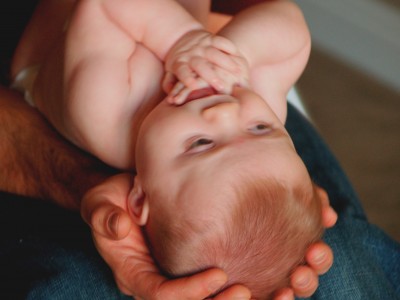 holding a baby for a photography shoot